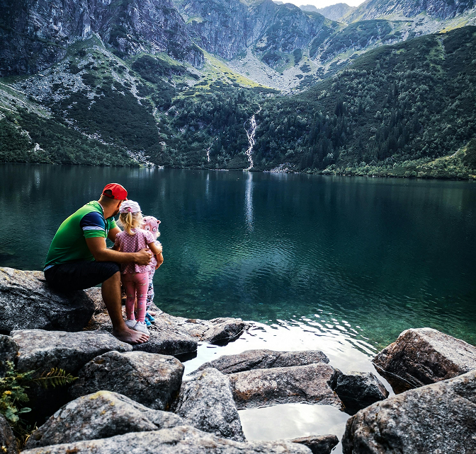 Father and daughters admiring view Father and daughters admiring view